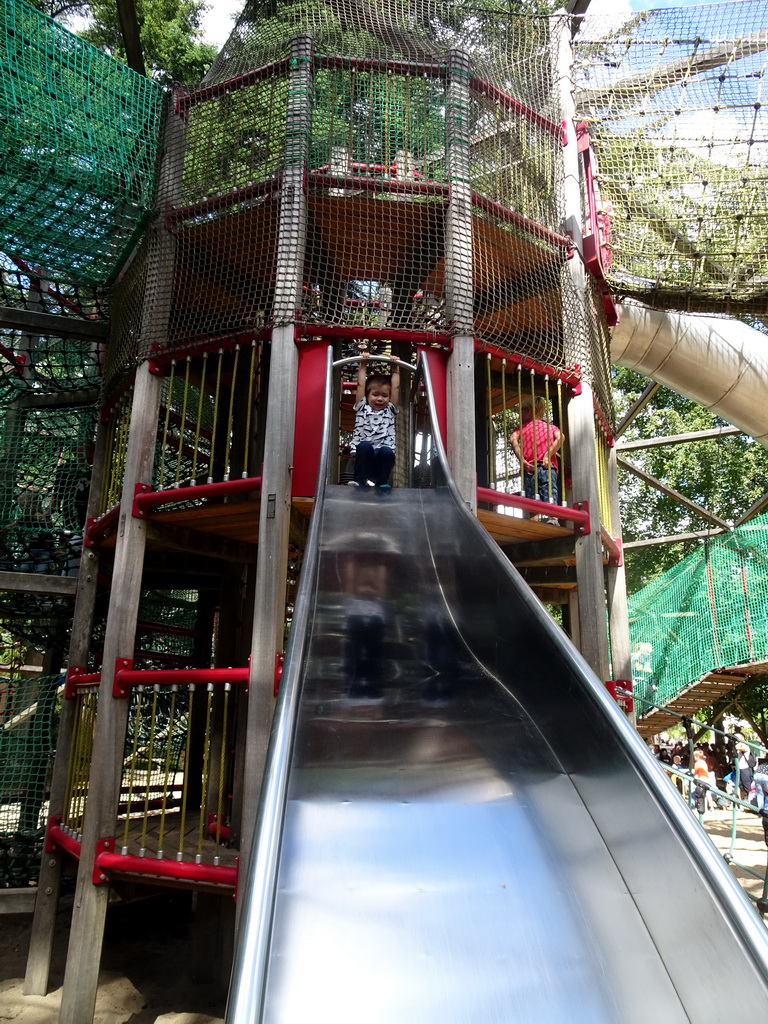 Max on a slide at the playground near the Restaurant Buitenplaats at the DierenPark Amersfoort zoo