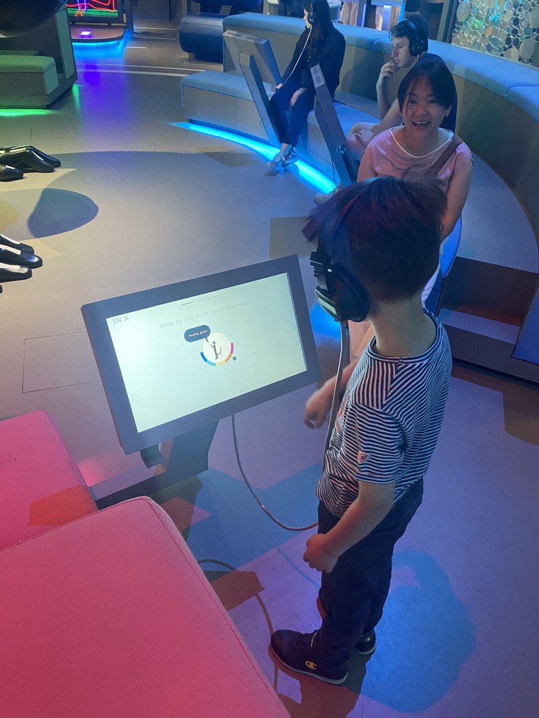 Max playing a music game at the Humania Exhibition at the Fourth Floor of the NEMO Science Museum