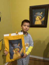 Max with the painting `Pikachu inspired by Self-Portrait with Grey Felt Hat` by Naoyo Kimura at the `Pokémon at the Van Gogh Museum` exhibition at the second floor of the Van Gogh Museum