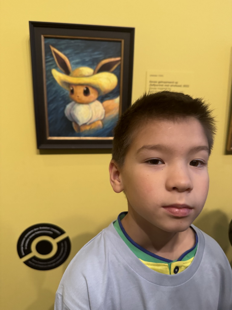 Max with the painting `Eevee inspired by Self-Portrait with Straw Hat` by Sowsow at the `Pokémon at the Van Gogh Museum` exhibition at the second floor of the Van Gogh Museum