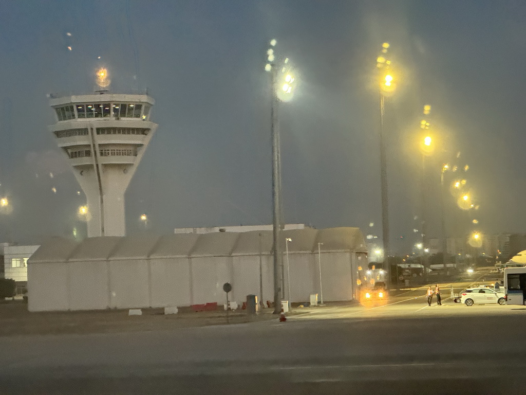 Control tower of Antalya Airport, viewed from the airplane, at sunset