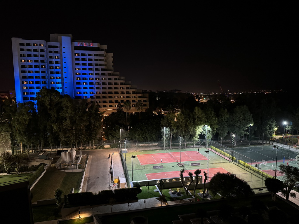 Sports fields at the Rixos Downtown Antalya hotel and the Özkaymak Falez Hotel, viewed from the balcony of our room, by night