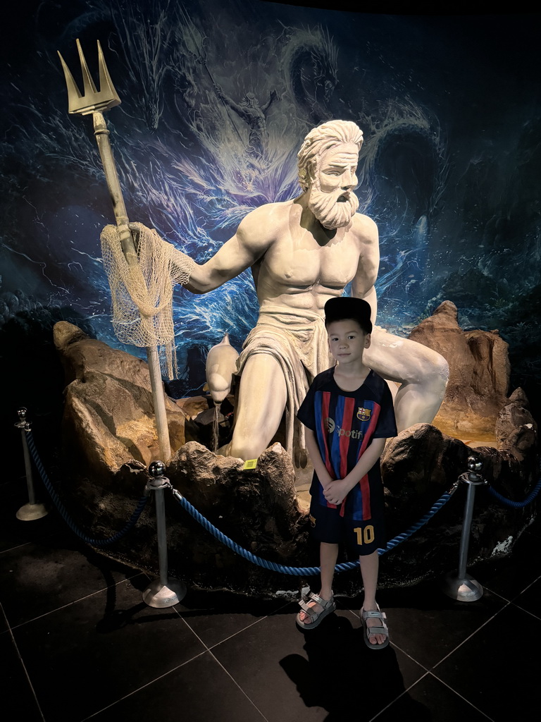 Max with a Poseidon statue at the entrance at the First Floor of the Aquarium at the Antalya Aquarium