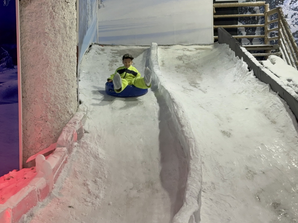 Max sliding down on a tyre at the Snow World at the Antalya Aquarium