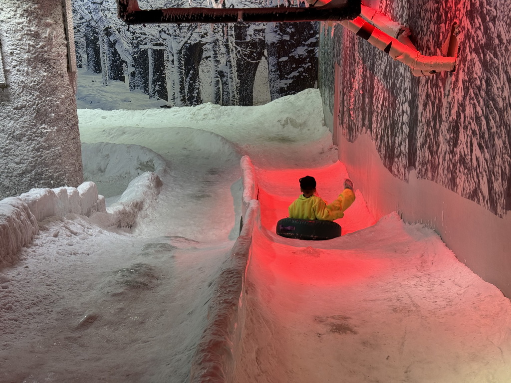 Max sliding down on a tyre at the Snow World at the Antalya Aquarium