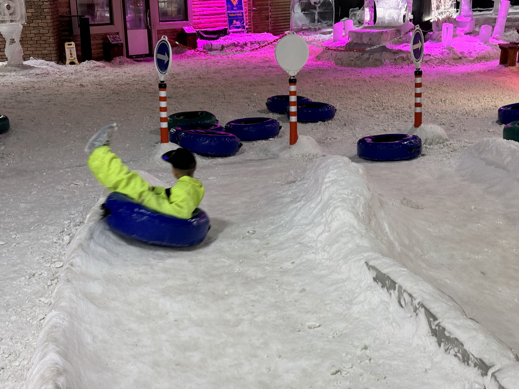 Max sliding down on a tyre at the Snow World at the Antalya Aquarium