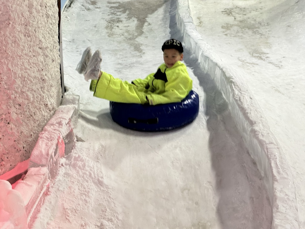 Max sliding down on a tyre at the Snow World at the Antalya Aquarium