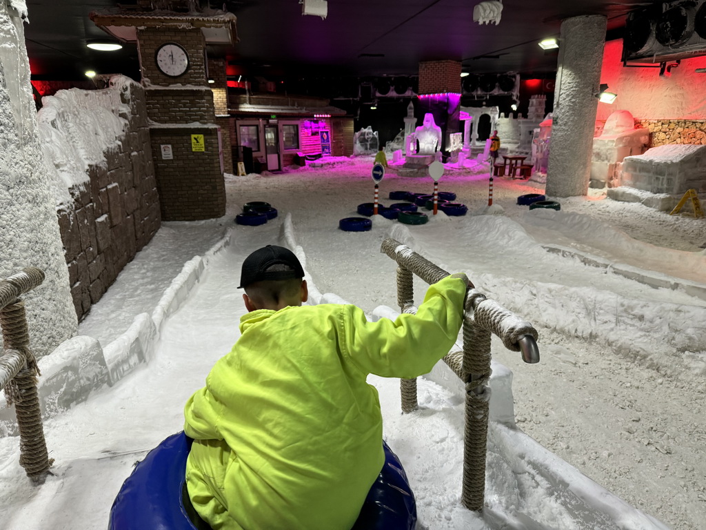 Max sliding down on a tyre at the Snow World at the Antalya Aquarium