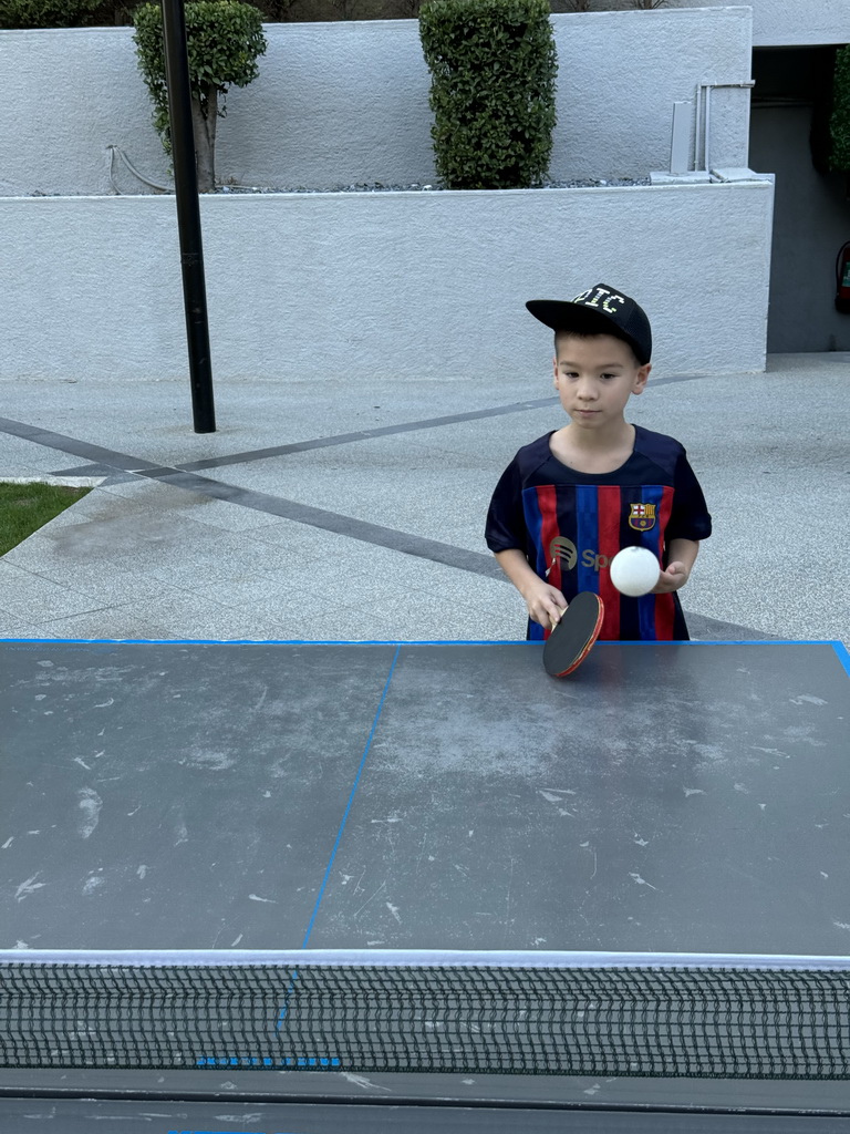 Max playing table tennis at the sports fields at the garden of the Rixos Downtown Antalya hotel