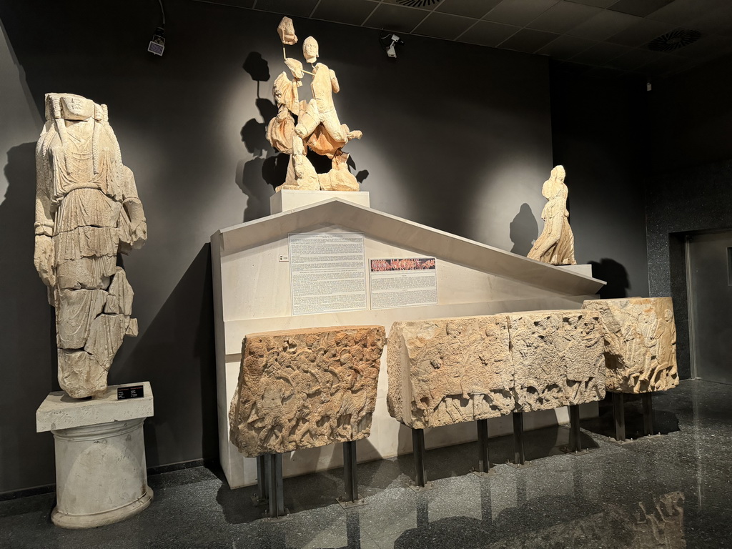 Statues and reliefs at the Hall of the Cult of the Dead at the ground floor of the Antalya Archeology Museum, with explanation