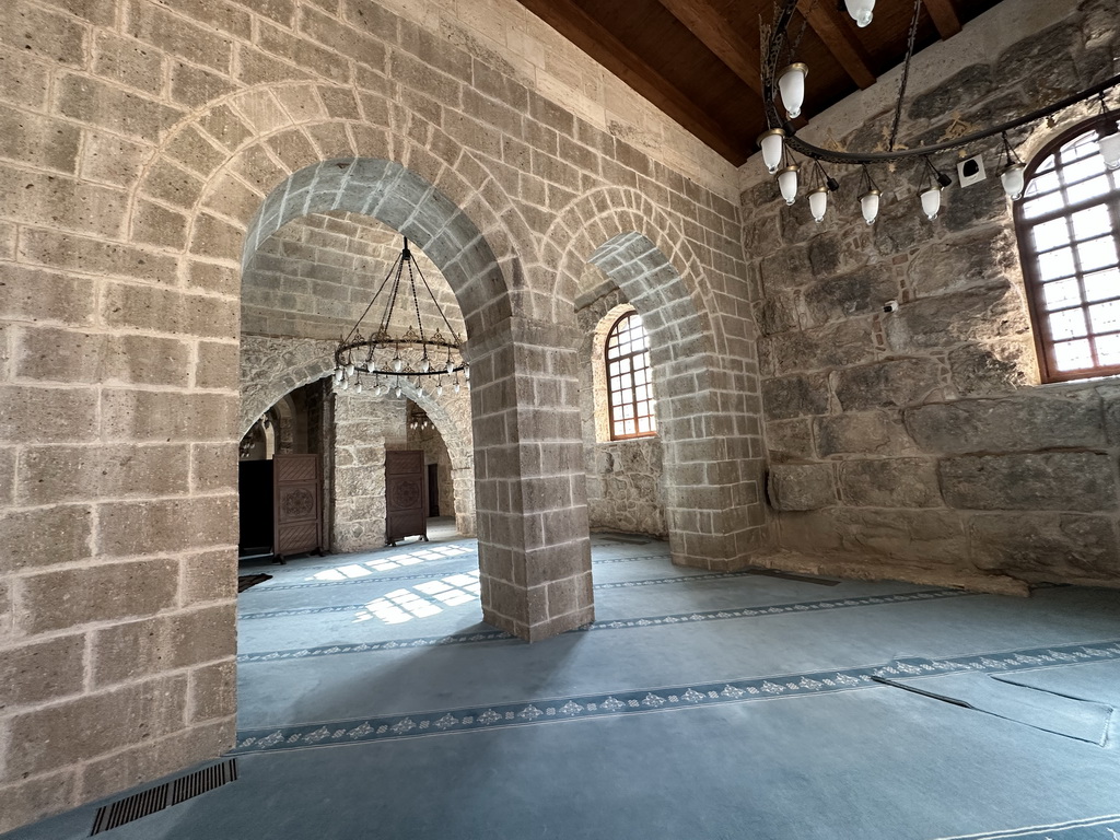 Arches, chandeleers and windows at the Sehzade Korkut Mosque