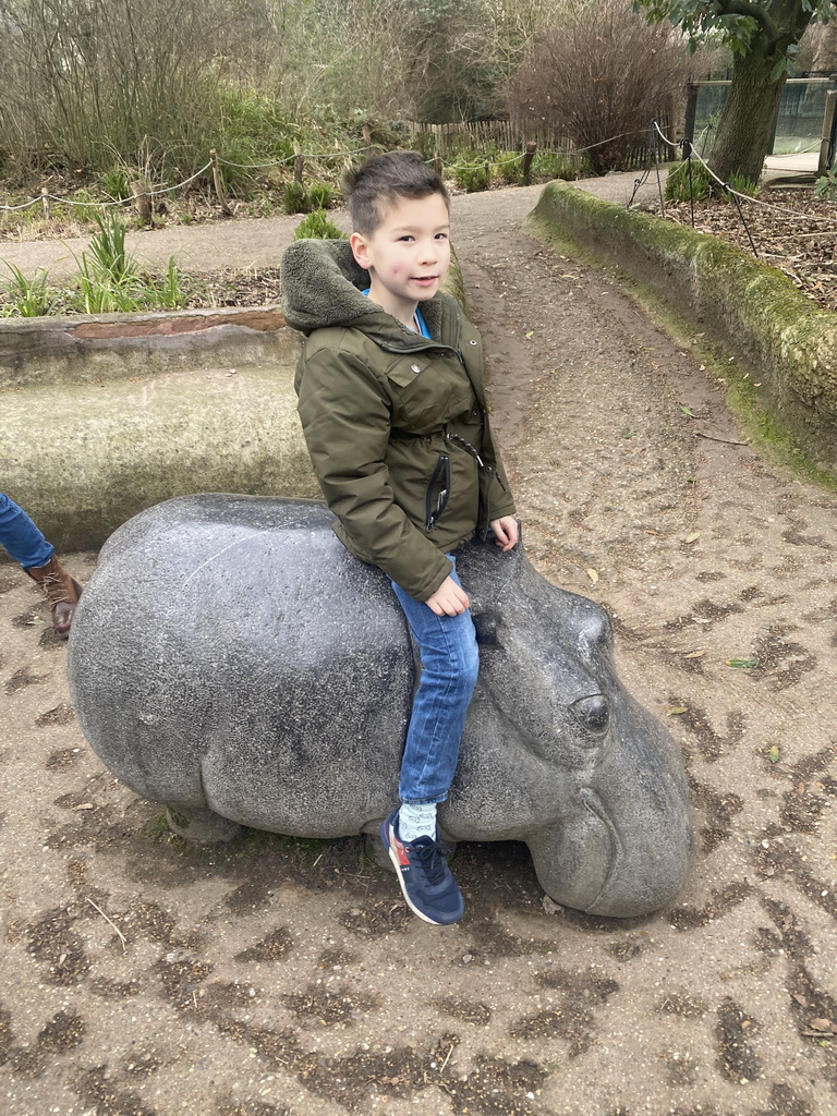 Max on a Hippopotamus statue at the Antwerp Zoo