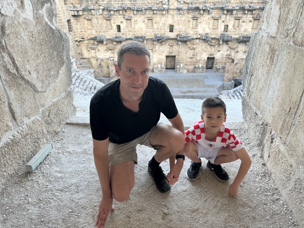 Tim and Max at the top of the west auditorium of the Roman Theatre of Aspendos, with a view on the stage and stage building