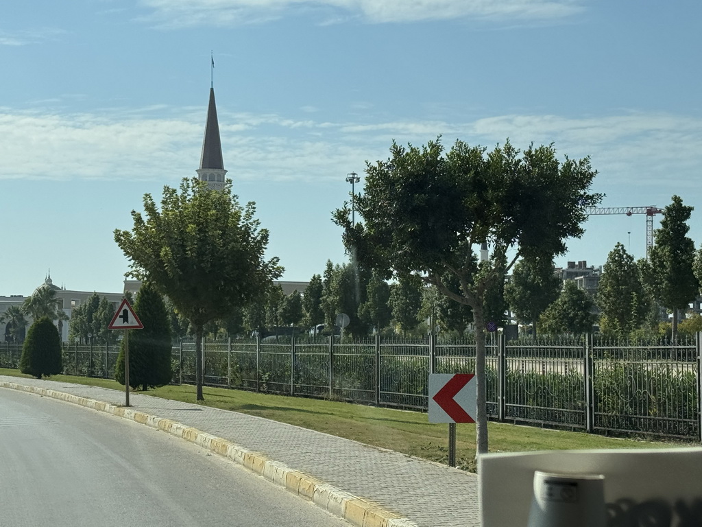 Tower of the Chateau at the Shopping Avenue area of the Land of Legends theme park, viewed from the bus on the Atatürk Caddesi street