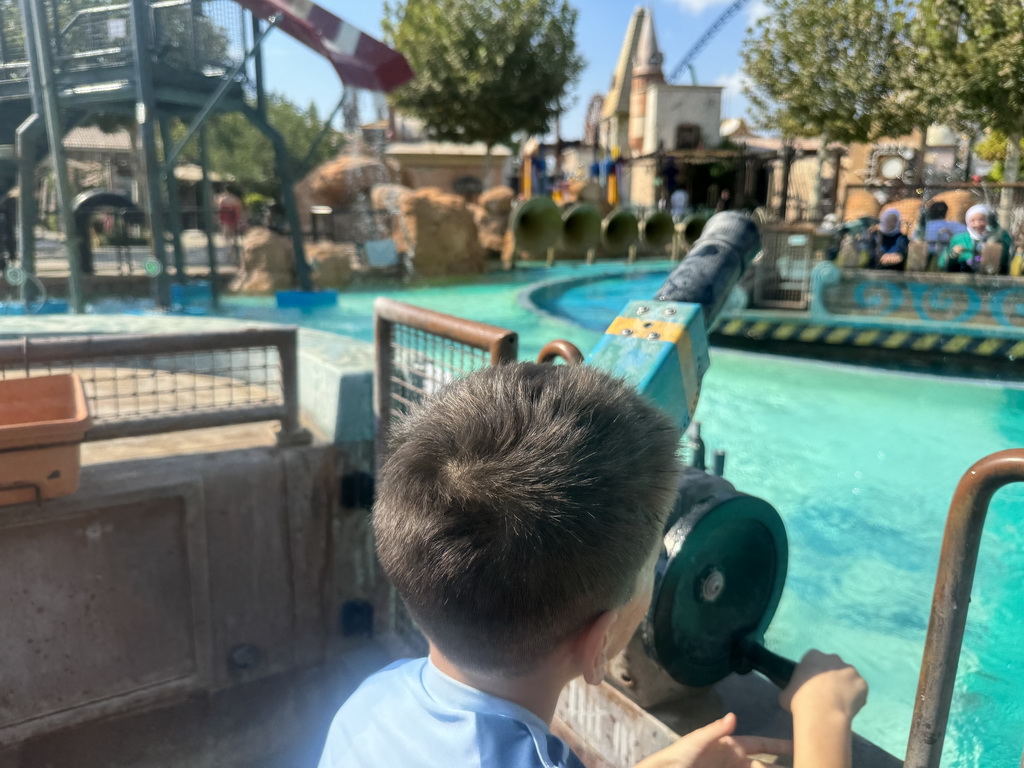 Max at a boat of the Watermania attraction at the Adventure Land area of the Land of Legends theme park