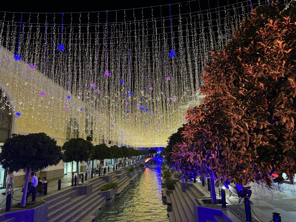 Lights and bridges over the canal at the Shopping Avenue area of the Land of Legends theme park, by night