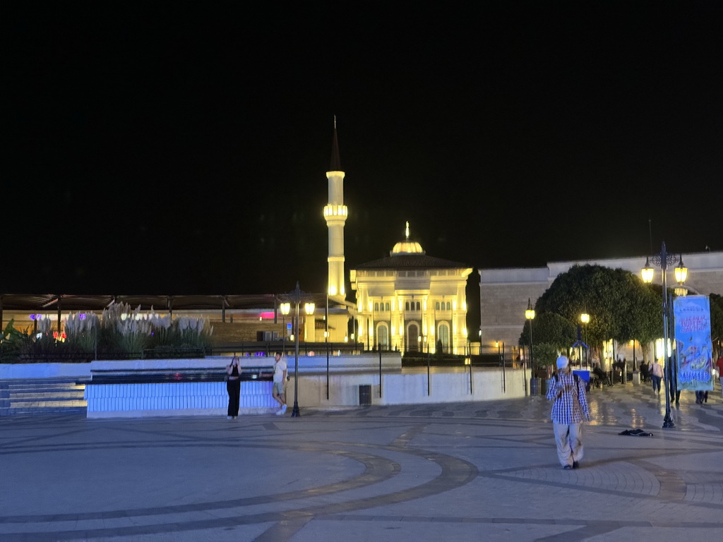 Shops at the north side of the Shopping Avenue area of the Land of Legends theme park, by night