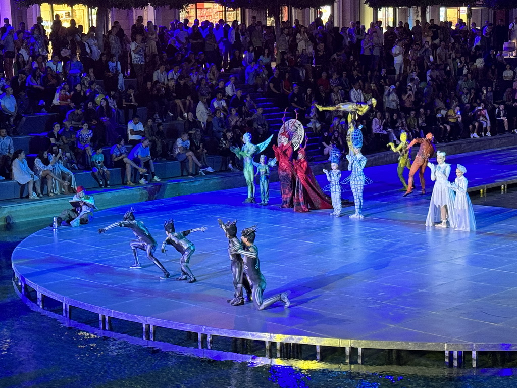 Actors in front of the Chateau at the Shopping Avenue area of the Land of Legends theme park, during the Musical Boat Parade, by night