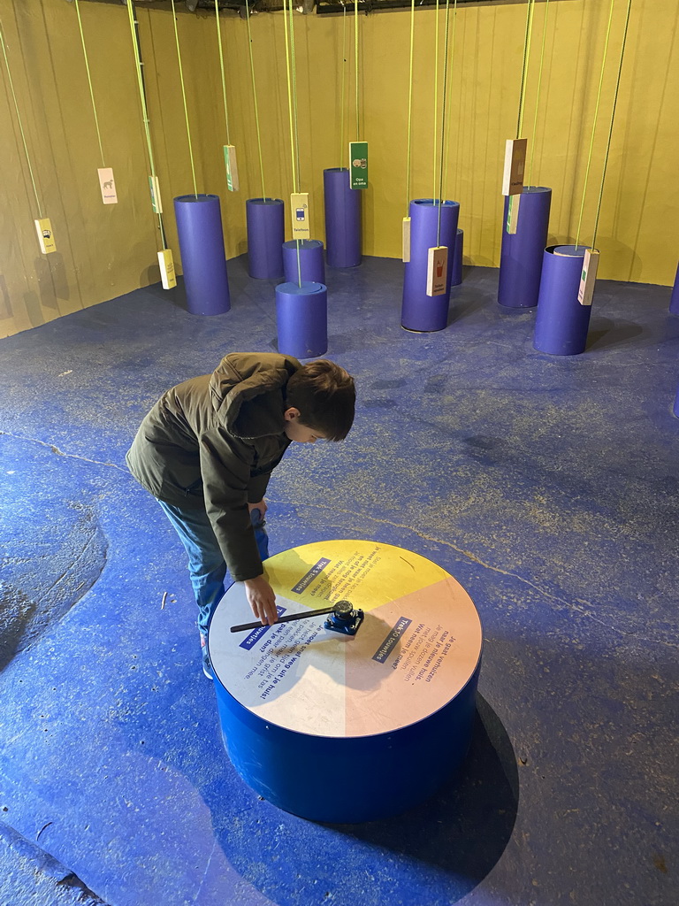 Max playing a game at the room of the grandchildren at the Ghana village at the Museumpark of the Africa Museum