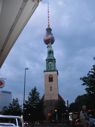 St. Mary`s Church and the Fernsehturm tower, viewed from the Karl-Liebknecht Straße street, at sunset