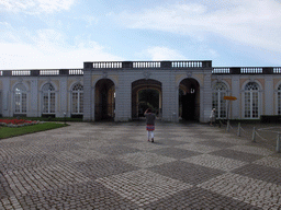 Miaomiao in front of the gate to the gardens of the Augustusburg Palace