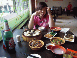 Miaomiao having lunch in a restaurant in the city center