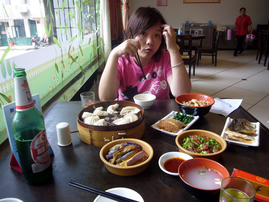 Miaomiao having lunch in a restaurant in the city center