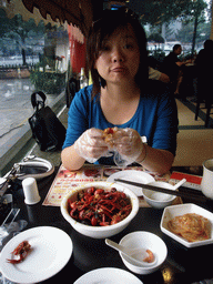 Miaomiao having dinner in a restaurant in the city center