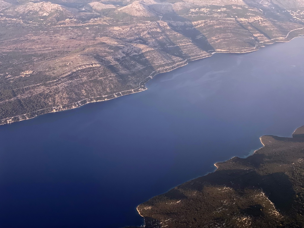 The town of Slano, the Adriatic Sea and the northeast side of the island of Sipan, viewed from the airplane from Rotterdam