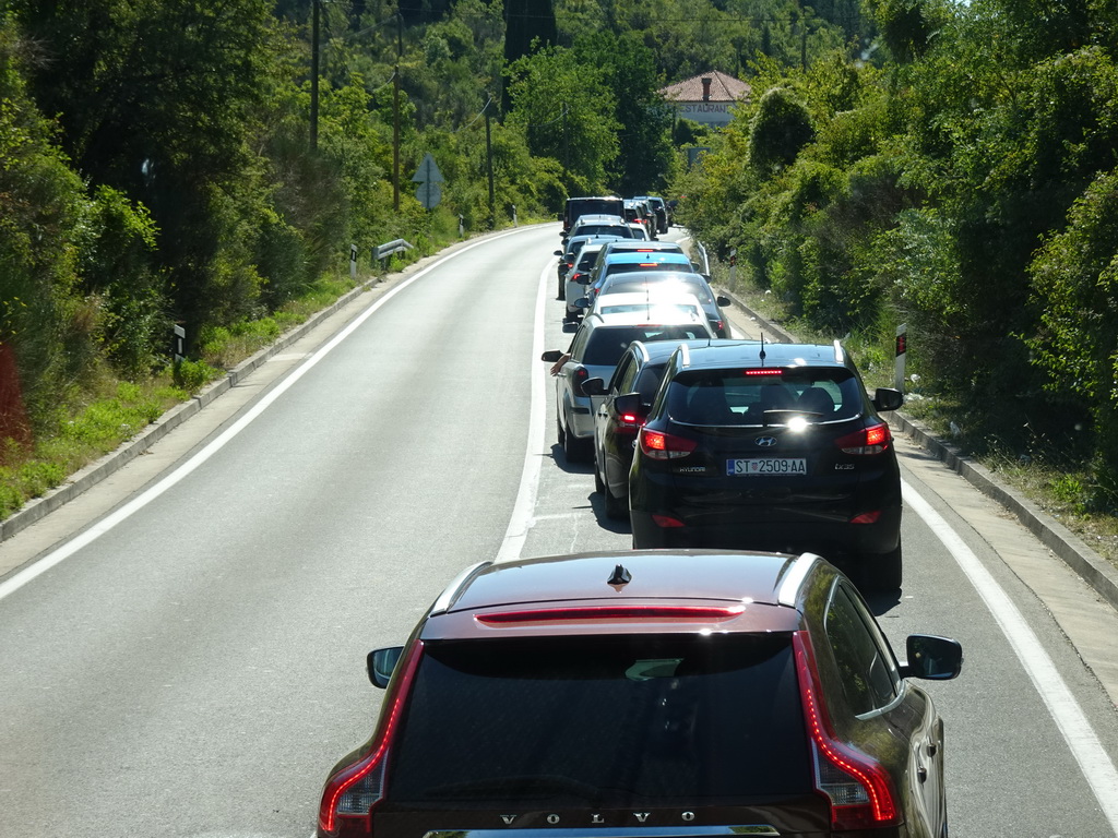 Cars waiting in line for the Croatia-Montenegro border crossing near the town of Plocice, viewed from the tour bus to Perast on the D8 road