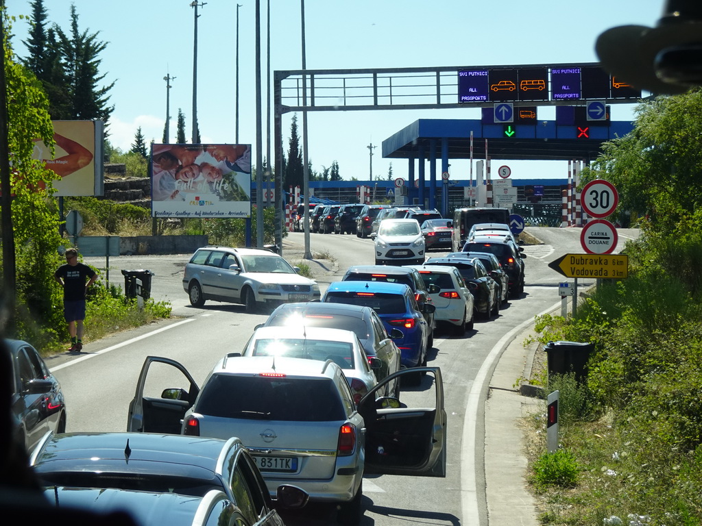 Cars waiting in line for the Croatia-Montenegro border crossing near the town of Plocice, viewed from the tour bus to Perast on the D8 road