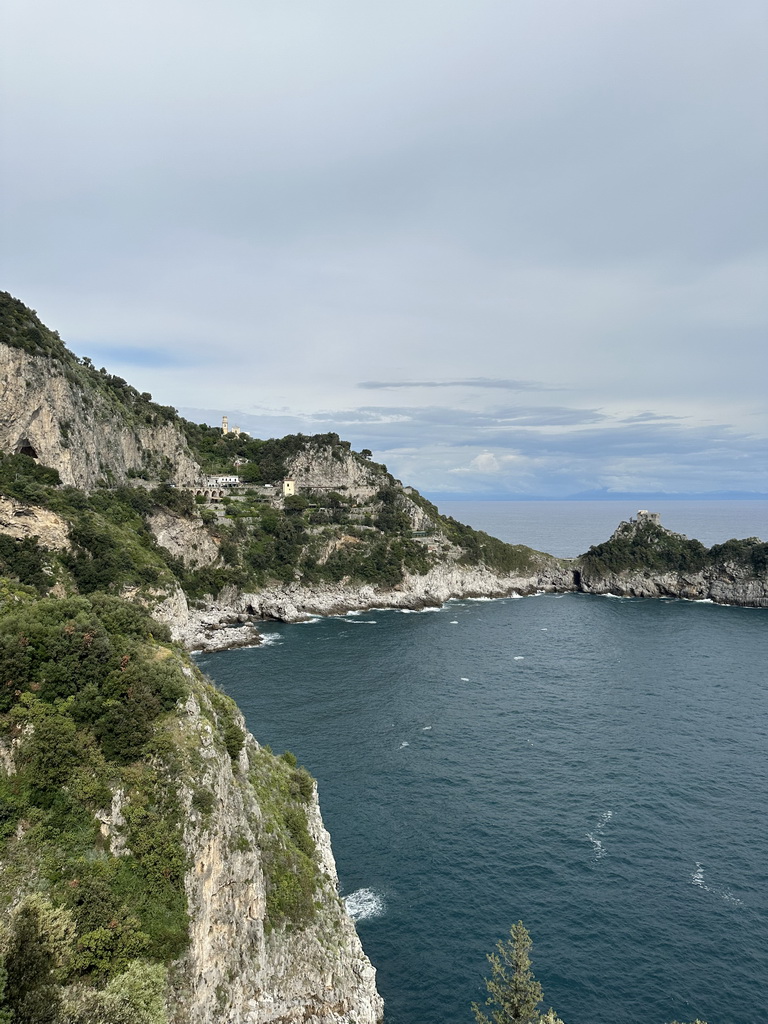 The Torre Capo di Conca tower, the west side of town with the Chiesa San Pancrazio Martire church and the Tyrrhenian Sea, viewed from the parking lot of the Grotta dello Smeraldo cave