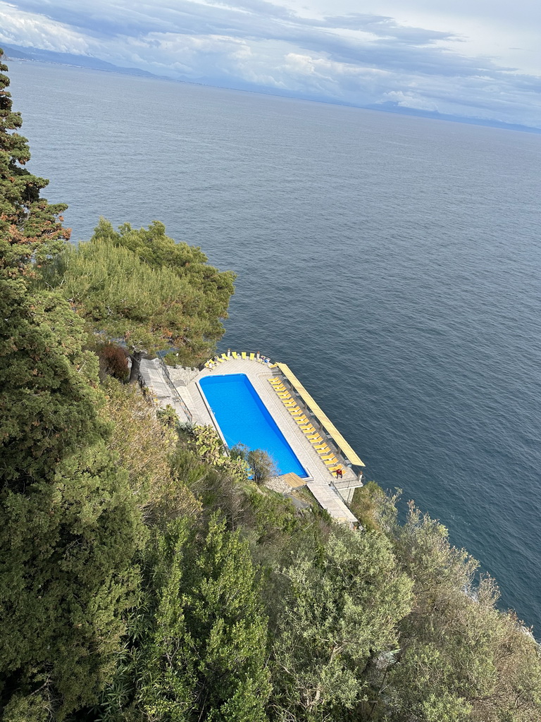 Swimming pool of Hotel Belvedere and the Tyrrhenian Sea, viewed from the parking lot