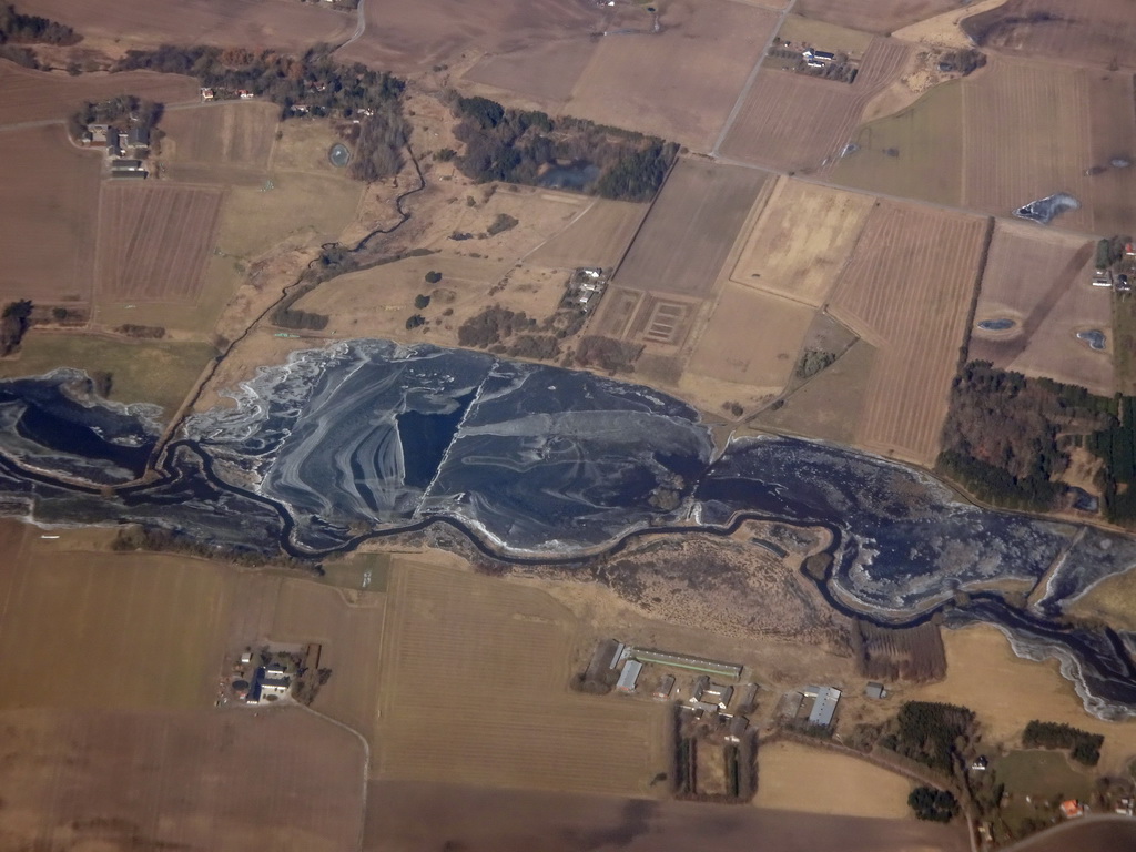 Frozen Suså river southwest of the city of Ringsted, viewed from the airplane from Amsterdam