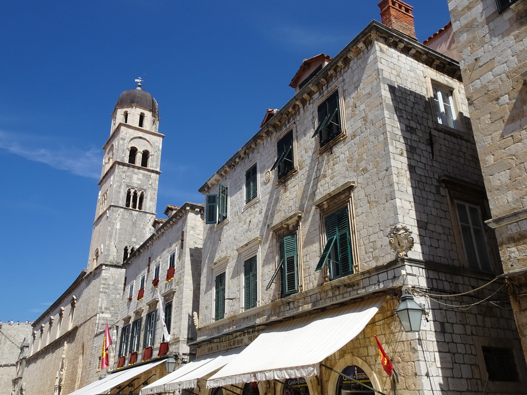 Facades of buildings and the tower of the Franciscan Church at the Stradun street