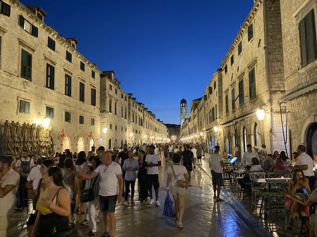 The west side of the Stradun street with the tower of the Franciscan Church, by night