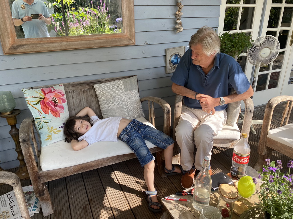 Max with his grandfather in the garden of the house of his grandfather at Brummen