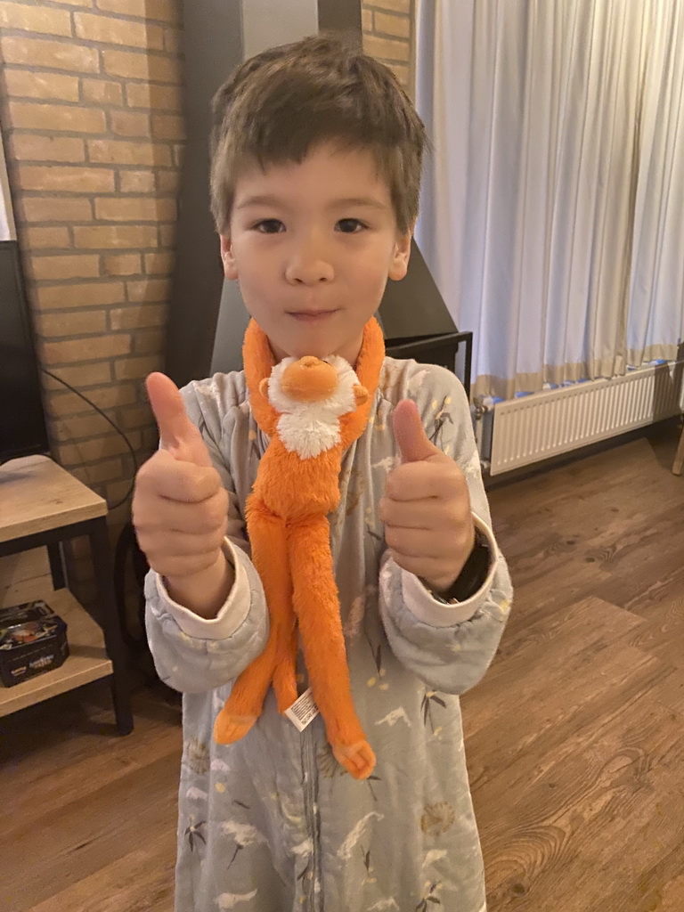 Max with a plush monkey in the living room of our holiday home at the Landal Coldenhove holiday park