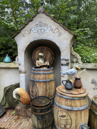 Wooden barrels, fox and bird at the Pinocchio attraction at the Fairytale Forest at the Marerijk kingdom