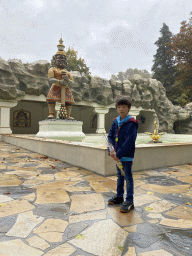 Max with a statue in front of the Indian Water Lilies attraction at the Fairytale Forest at the Marerijk kingdom