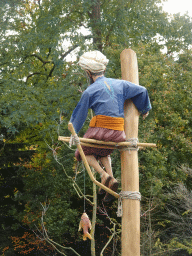 Statue of a fisherman at the Archipel water playground at the Reizenrijk kingdom, viewed from the waiting line for the Sirocco attraction