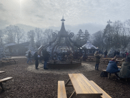 Campfire, stalls and tables at the Warme Winter Weide square at the Reizenrijk kingdom, during the Winter Efteling