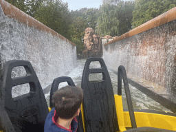 Max in our boat and waterfalls at the Piraña attraction at the Anderrijk kingdom