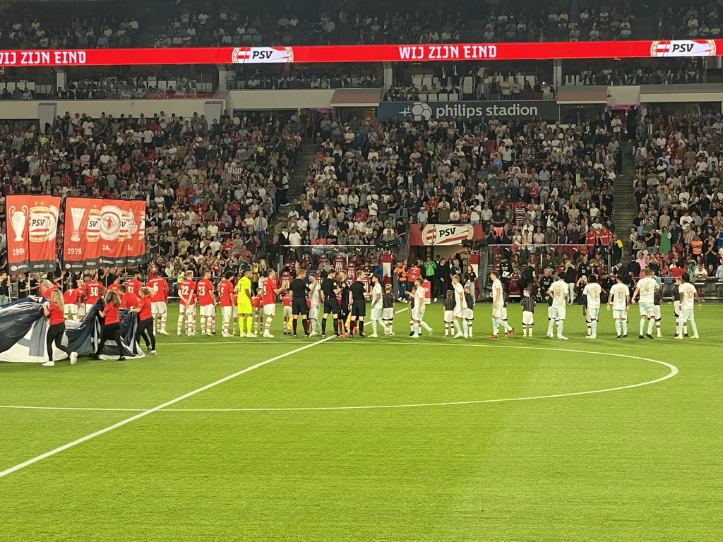 Referees and players on the pitch at the Philips Stadium, viewed from the Eretribune Noord grandstand, just before the football match PSV - NEC