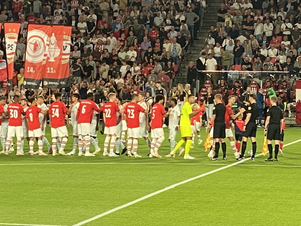 Referees and players on the pitch at the Philips Stadium, viewed from the Eretribune Noord grandstand, just before the football match PSV - NEC