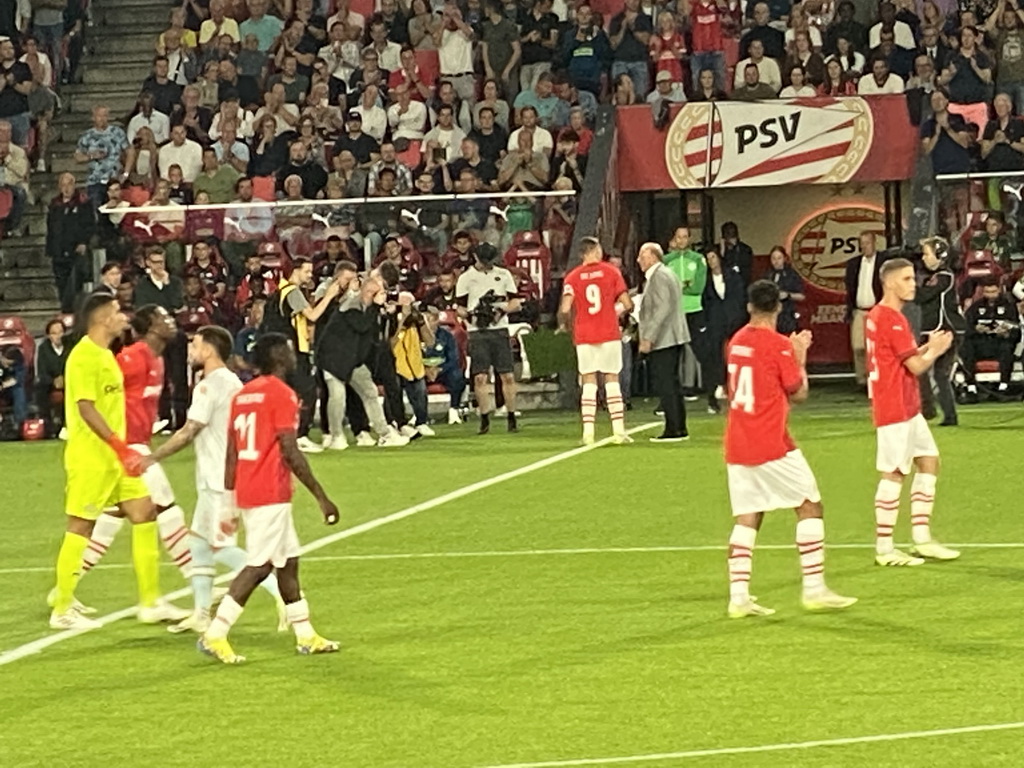 PSV captain Luuk de Jong receiving an award for 250 matches for PSV on the pitch at the Philips Stadium, viewed from the Eretribune Noord grandstand, just before the football match PSV - NEC