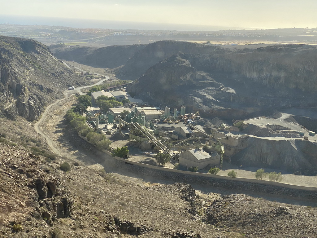 The Barranco de Vicentillos dam at the south side of the Barranco de Fataga ravine, viewed from the tour bus on the GC-60 road