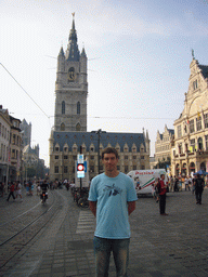 Tim at the Sint-Baafsplein square with a view on the Belfry of Ghent, the Lakenhalle building, the NTGent Theatre and the Sint-Niklaaskerk church