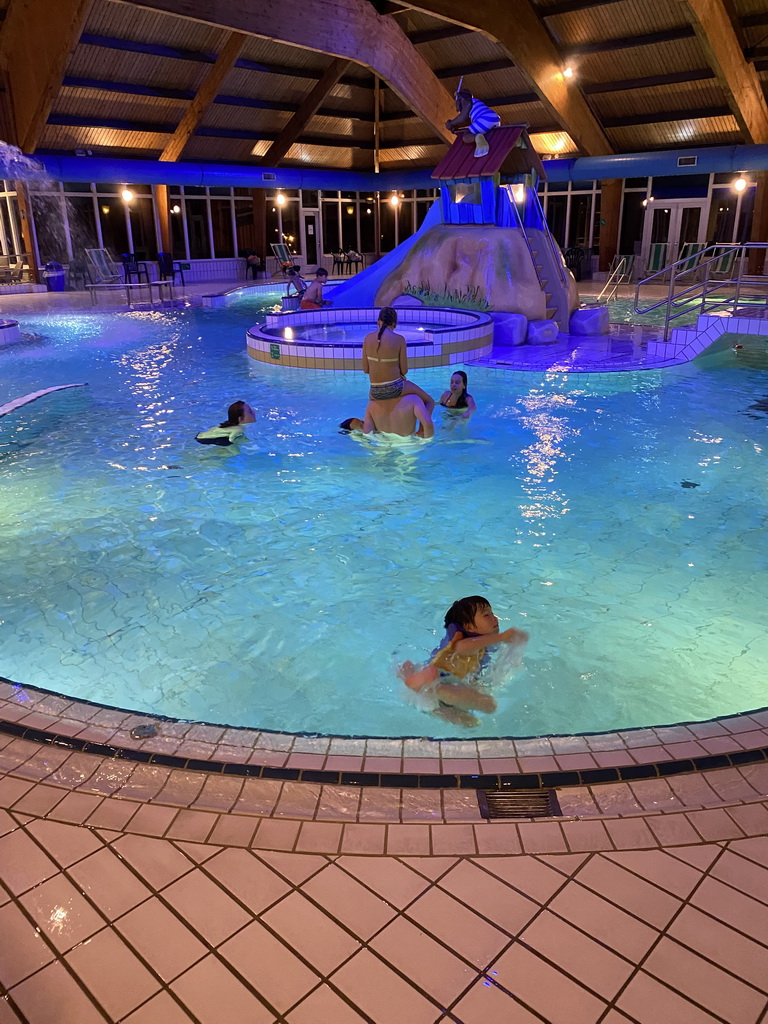 Max at the swimming pool at the Landal Miggelenberg holiday park, by night