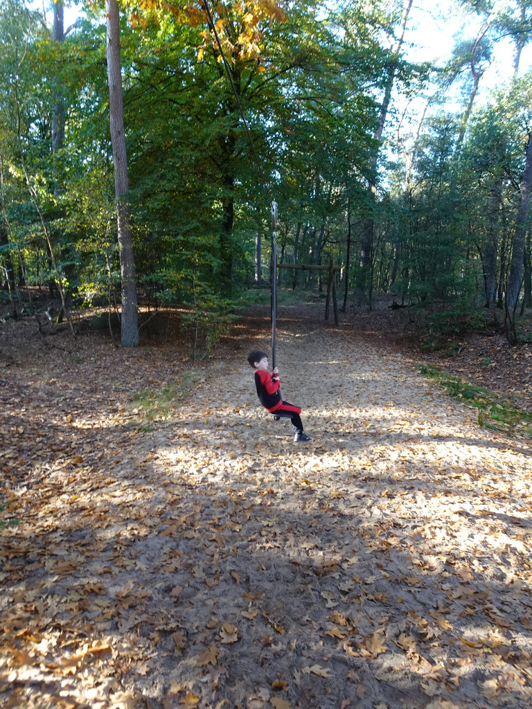 Max on a zip line at the playground next to the Park Pavilion